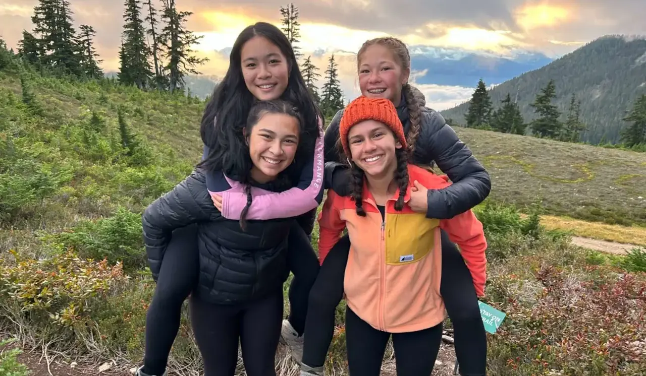 students piggybacking each other