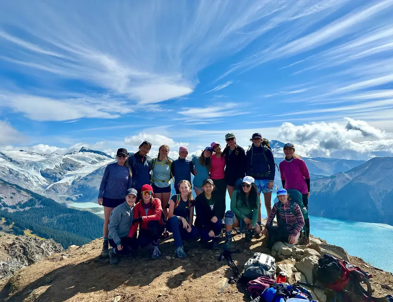 Teachers on top of a mountain smiling