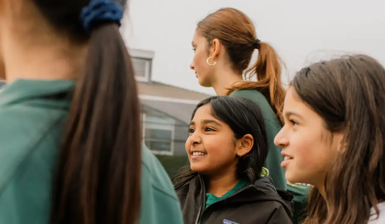 Younger students looking up