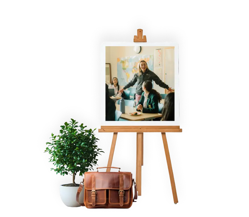 Easle with image of teacher with students