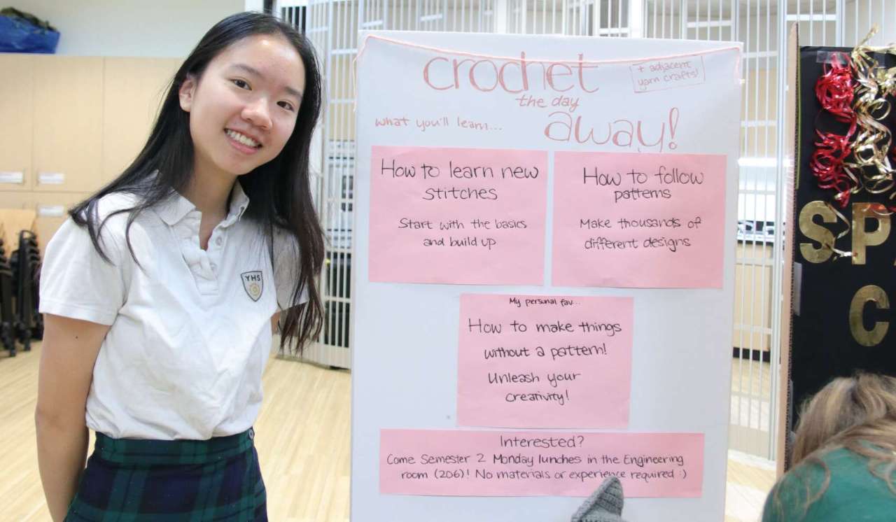 Student by club board